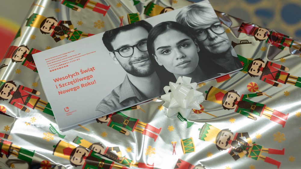 a Christmas gift with the UL Christmas card with the inscription Merry Christmas and a Happy New Year