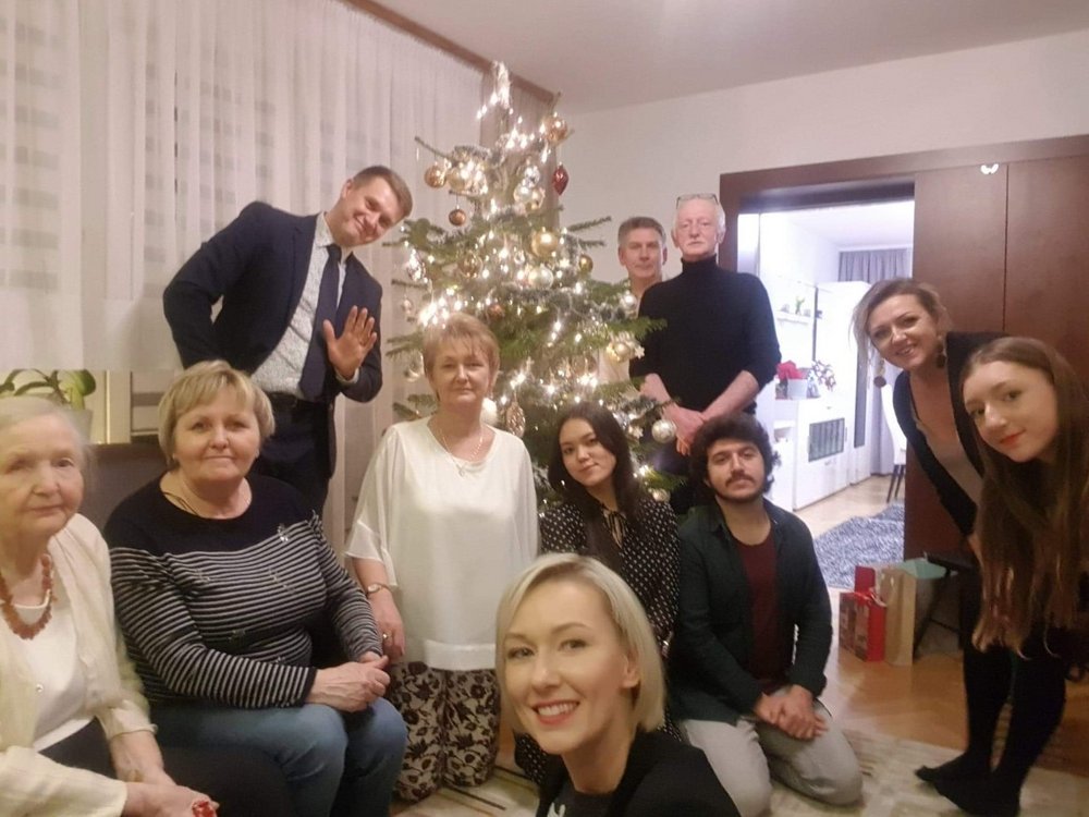 a group photo of a family taking part in the campaign with their international guests