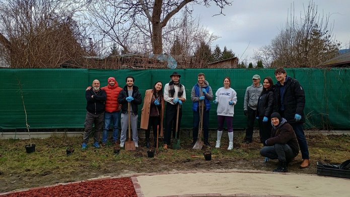 People involved in planting trees and shrubs in Lumubowo