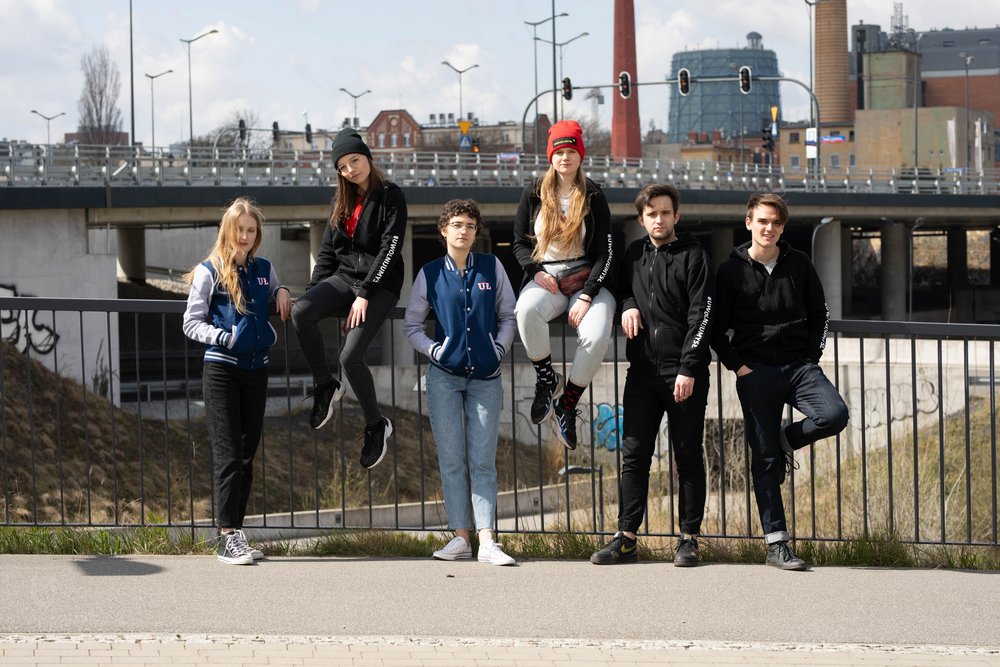 Students of the University of Lodz on the background of the city