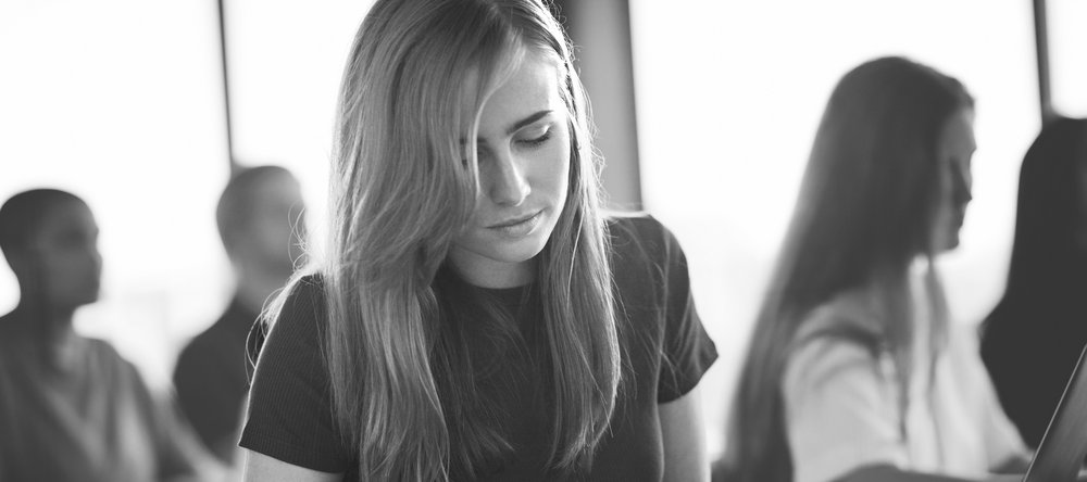 Young people sitting in a lecture room