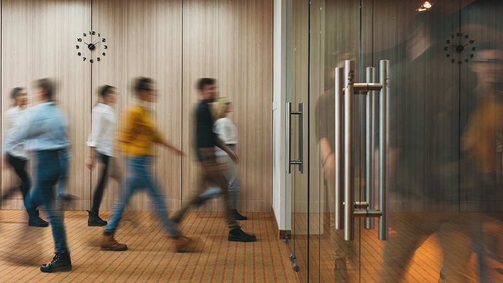 a decorative element: people walking in the office