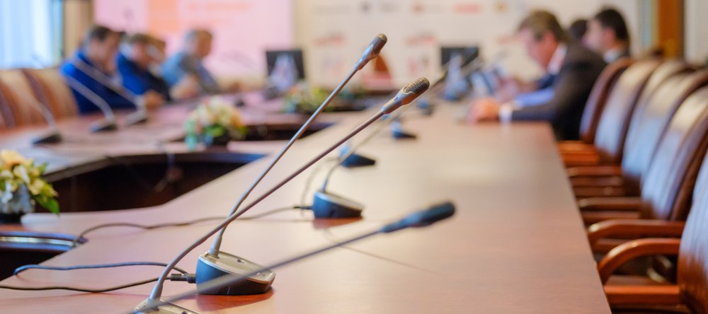 Microphones on the table in the conference room