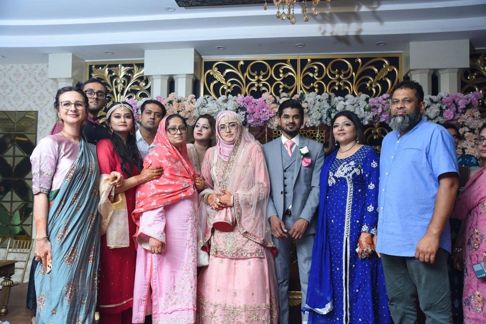 Wedding guests together with the student during a wedding in Pakistan