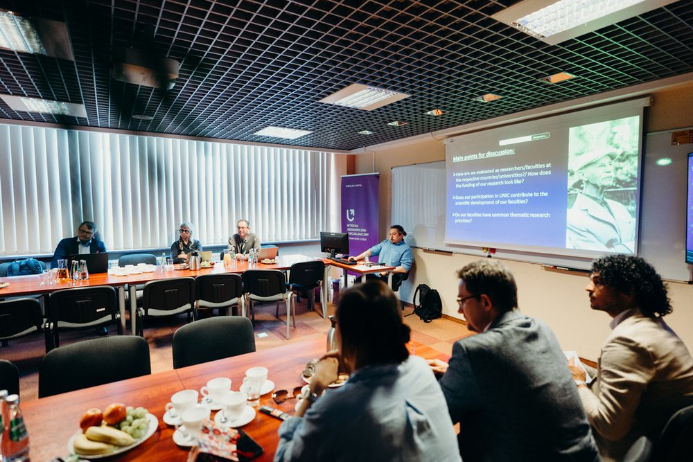 the meeting participants sitting at tables