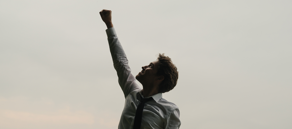 A man with his fist raised – a gesture of triumph