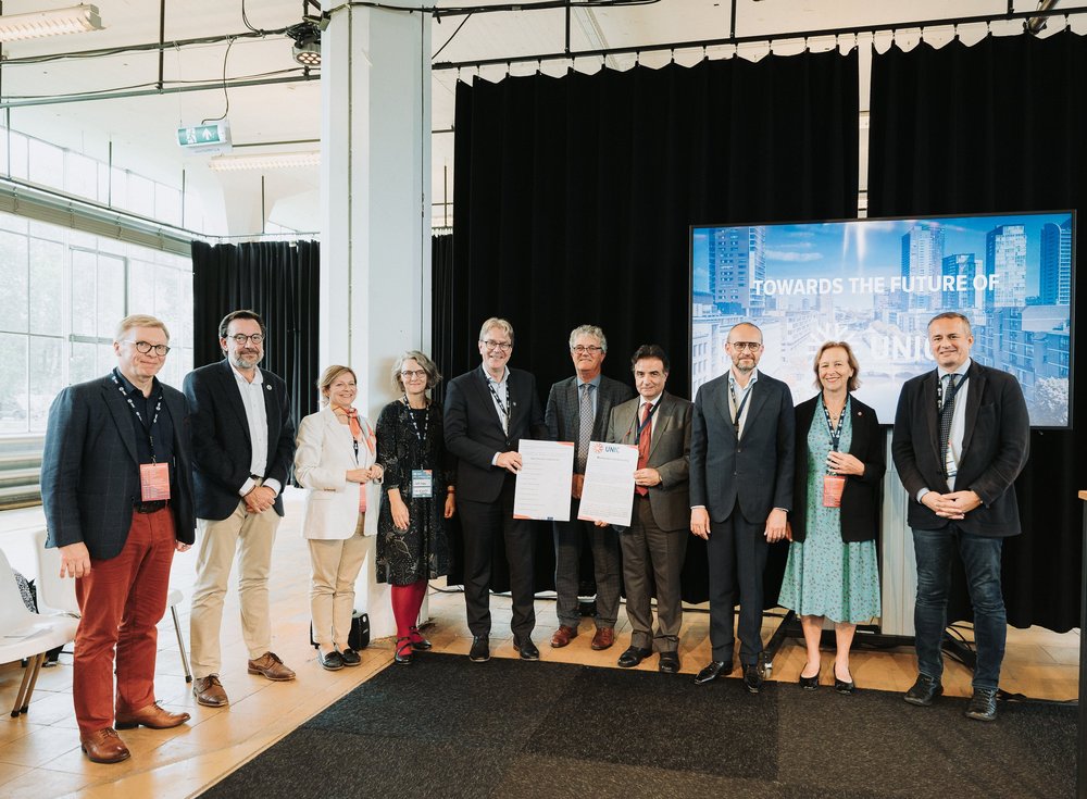 a group photo after signing the new memorandum of understanding (for UNIC 2.0) 