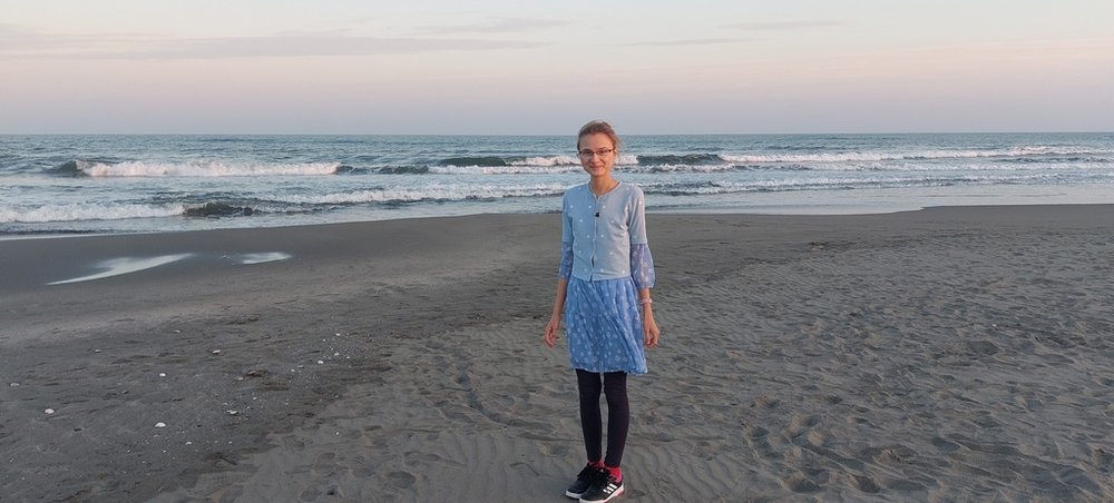 The scholarship holder on a beach